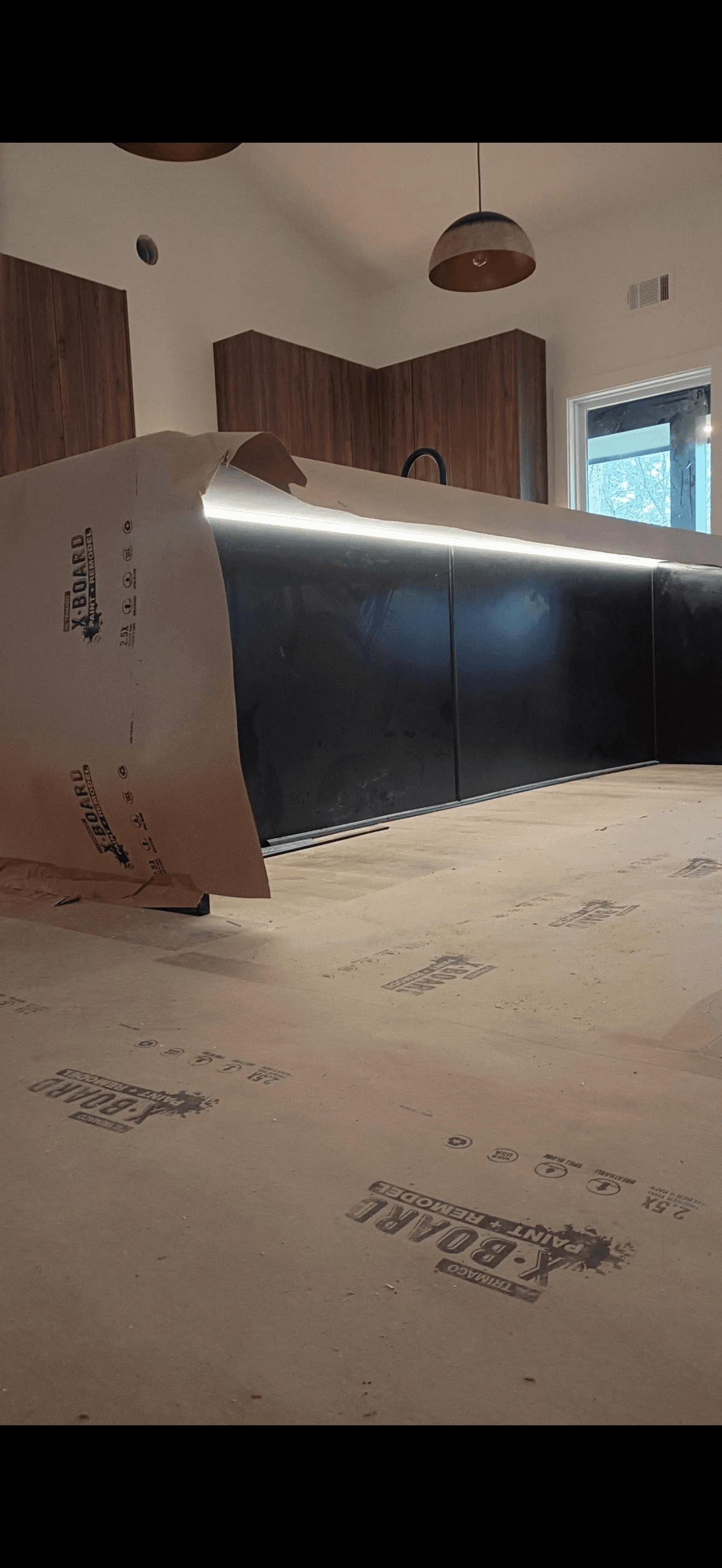 Modern kitchen with LED under-cabinet lighting installed by Letrix